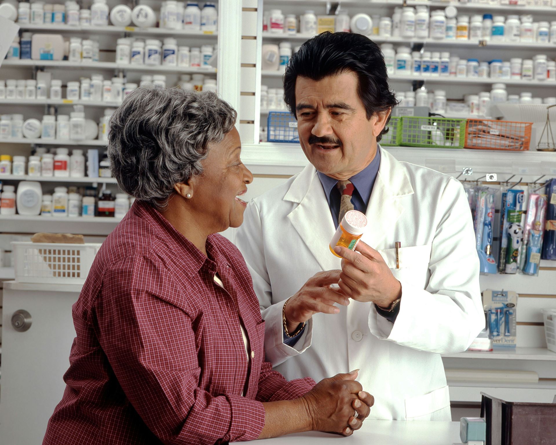 pharmacist providing medication to a patient 